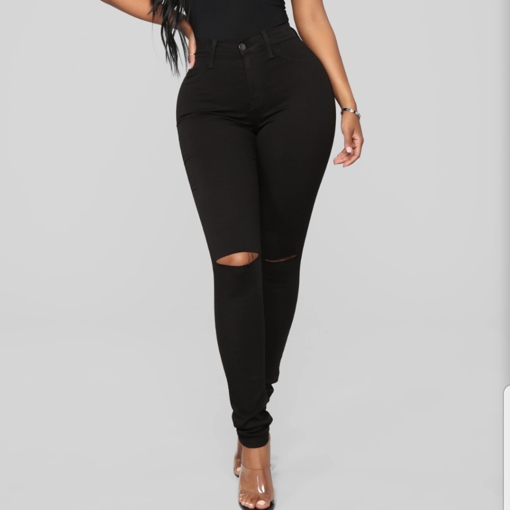 Black skinny jeans with knee slit